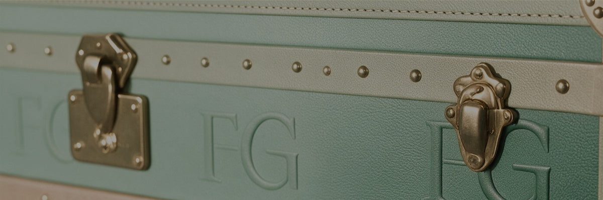 A Forrey & Galland travel trunk embossed with the FG monogram