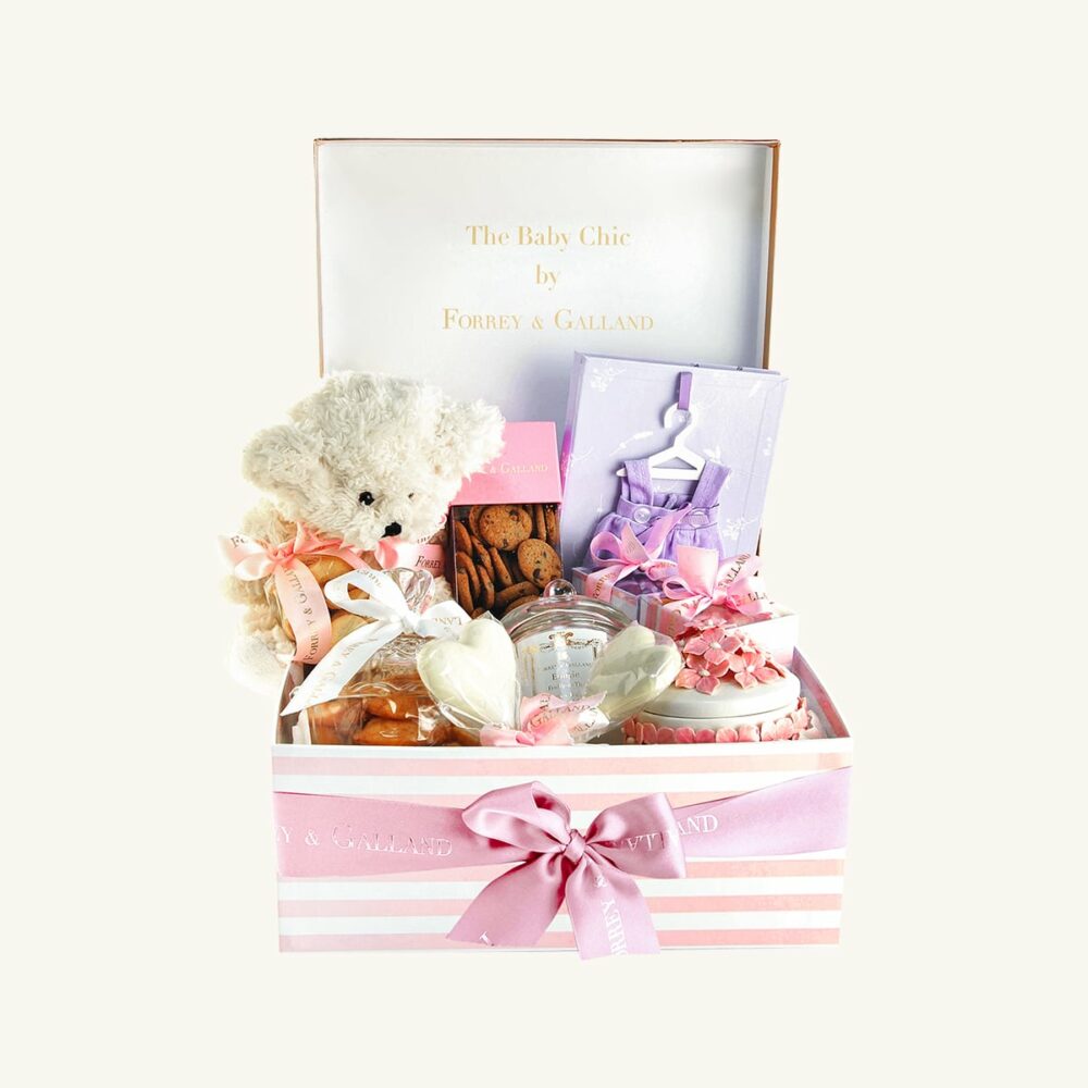 Baby hamper containing handmade cookies and chocolates box for a baby shower