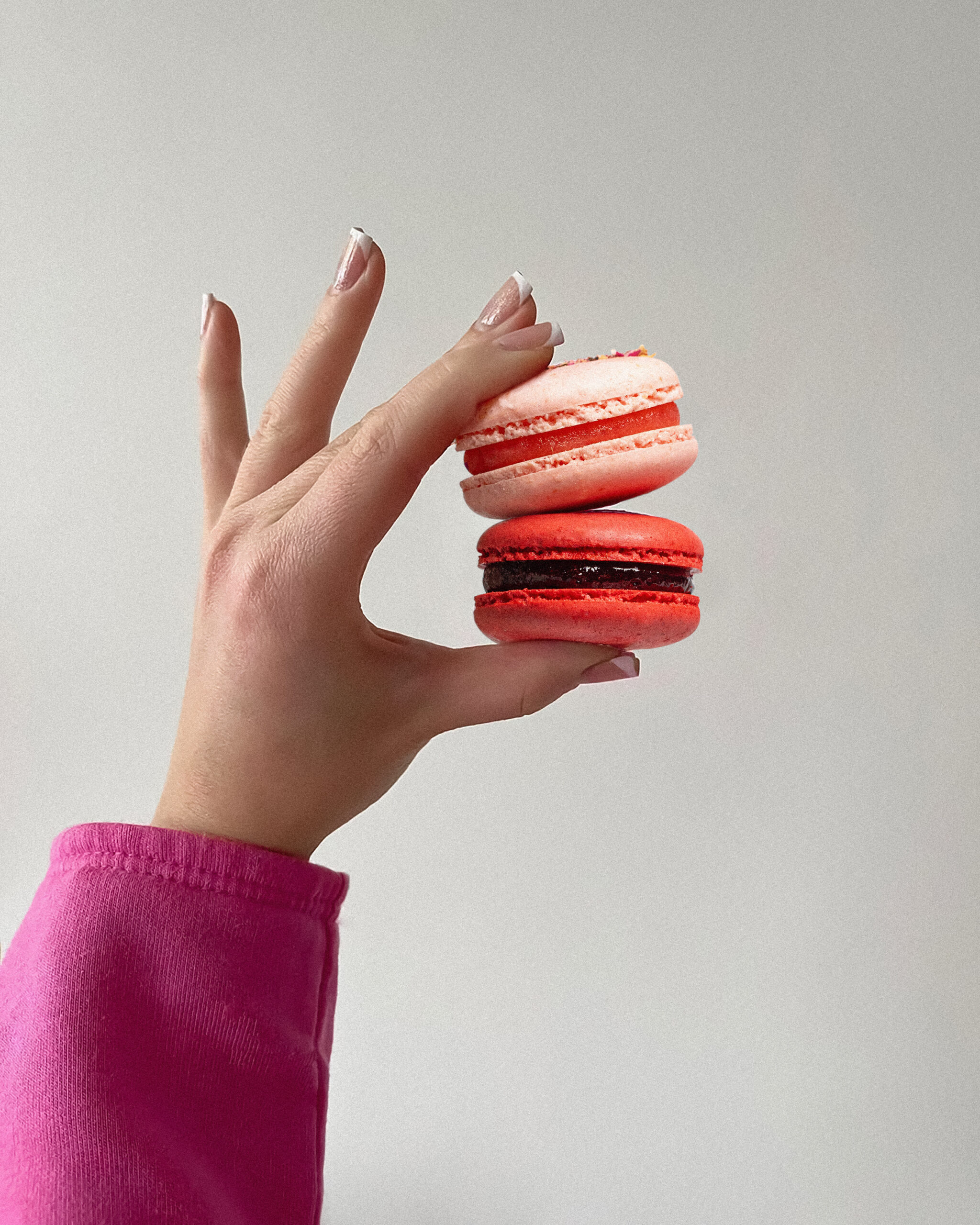 French macarons held in hand
