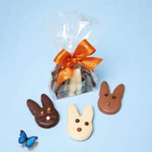 Handmade Easter sable rabbit biscuits coated in milk dark and white chocolate